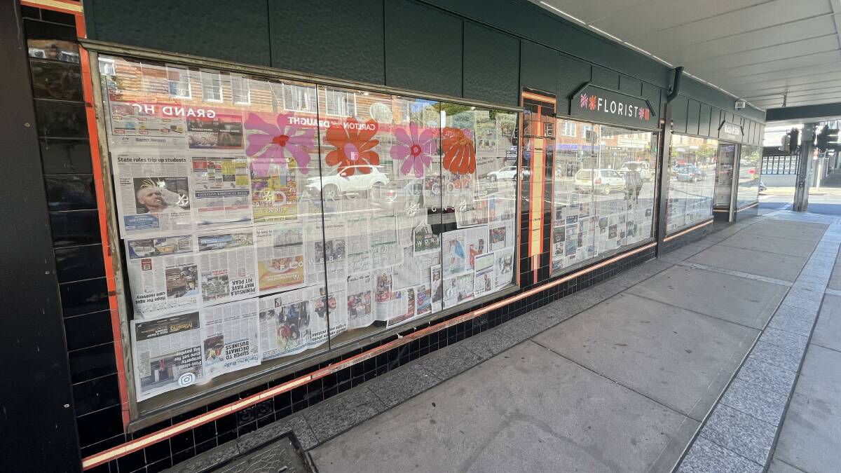 Newspapers cover the windows of the soon-to-be opened space. Picture by James Parker