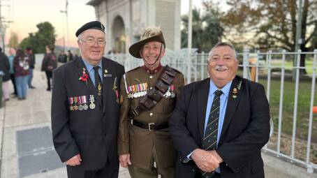 Ex-servicemen and members of the Bega RSL Sub-branch, Ken Pritchard, Mick Symon, and Gary 'Wombat' Berman at the Bega War Memorial. Picture by James Parker