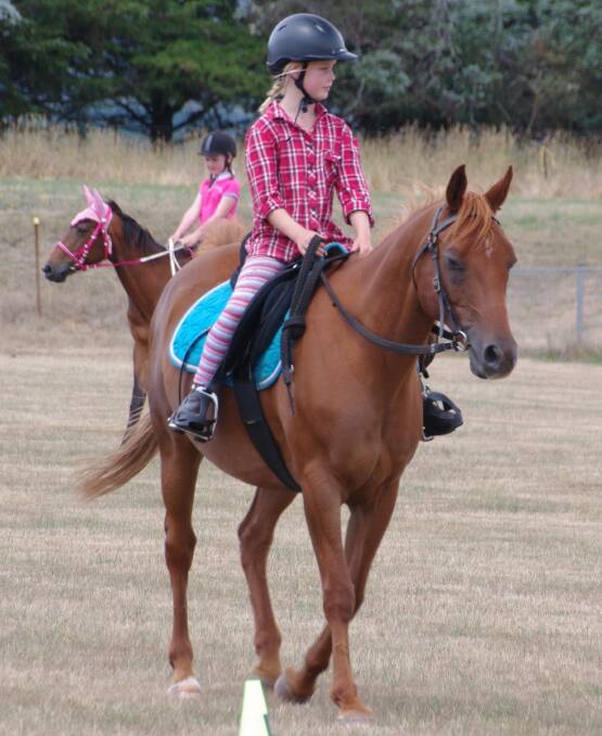 YOUNG RIDERS: Natalie Vincent enjoys a ride as part of the weekend's Delegate Pony Club rally. More photos, Page 8