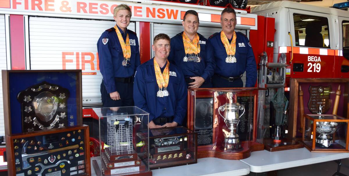 Bega firefighters Cassandra Dickson, Trent Smith, Clinton Towill and Gerard Hanscombe proudly show off their state championship trophy haul.