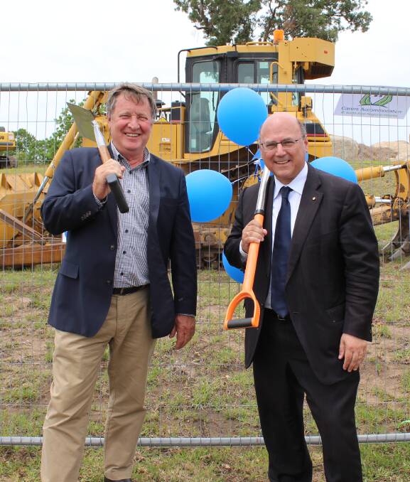 UNDERWAY: Bega Cheese's Max Roberts and Liberal Party Senator Arthur Sinodinos turn the first sod of the Community Carers Accommodation project at the South East Regional Hospital site near Bega.