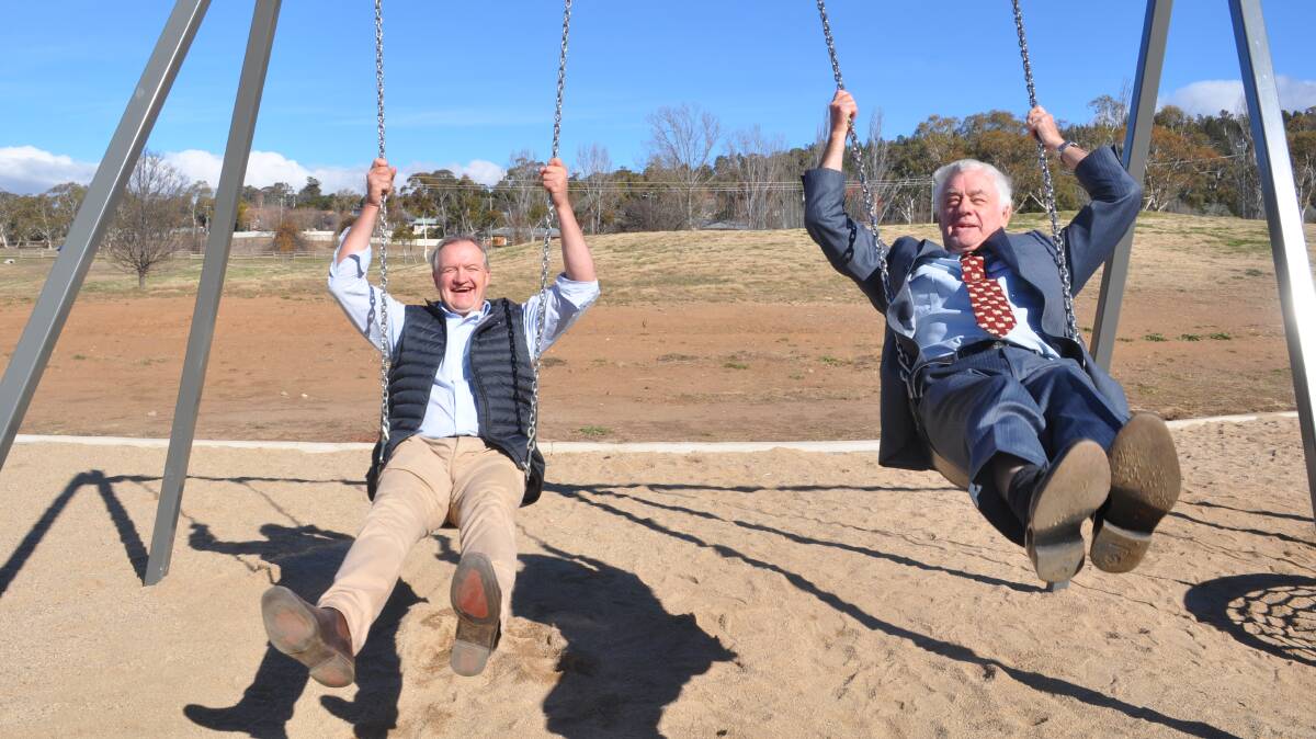 Snowy Monaro Regional Council Administrator Dean Lynch and Cooma Lions President Roger Norton test out the new Cooma Lions Park equipment