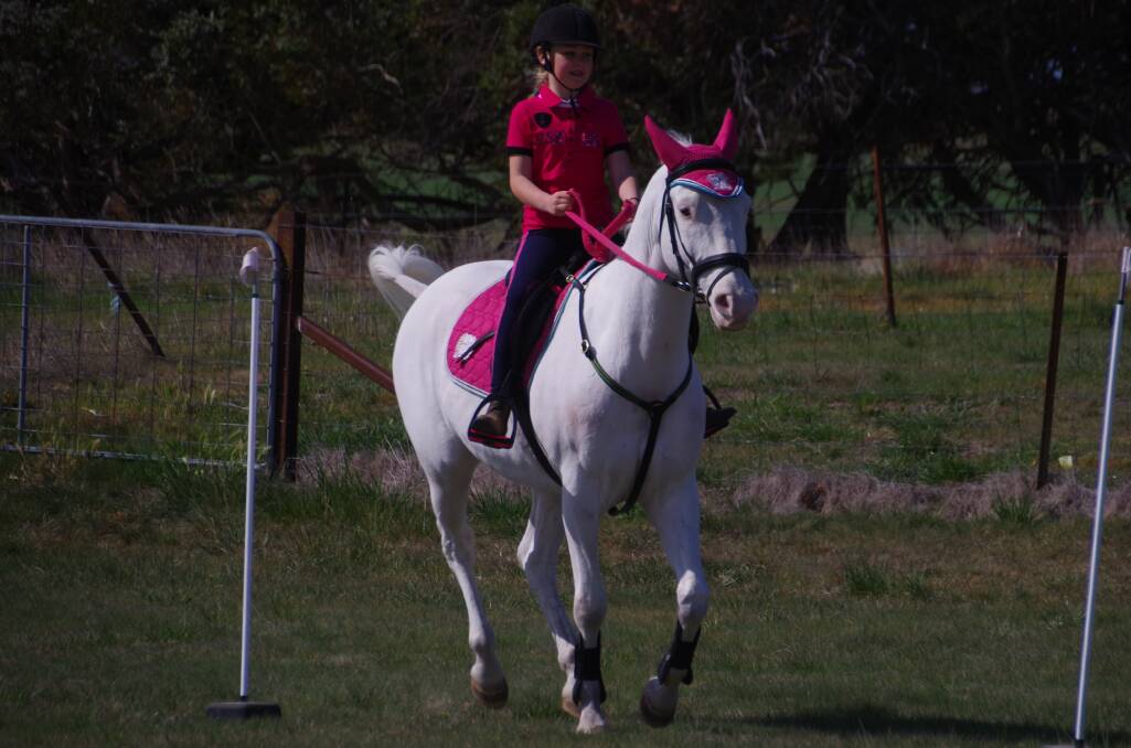 Indi White rides through the flags course during the Delegate Pony Club meet on the weekend.