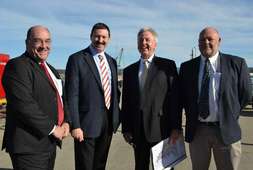 Regional Development Australia board member and Bega Valley Shire councillor Russell Fitzpatrick celebrates federal funding announcement for Eden Wharf in 2013 with then member for Eden-Monaro Mike Kelly, Bega Valley Shire general manager Peter Tegart and RDA board member Nick Machim.