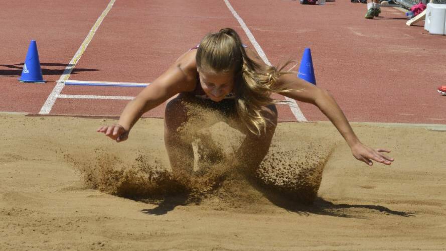 Stretching: Monique Edmunds goes for distance in the long jump at Barden Park on Sunday. Photos: PAIGE WILLIAMS