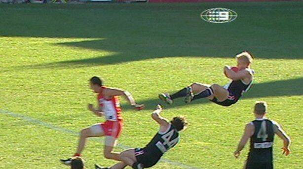 Nick Riewoldt [St Kilda] running back with the flight of the ball, takes one of footy's great marks in 2004 at the SCG Photo: Nine Network