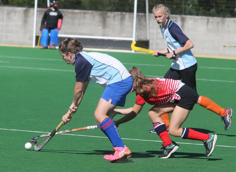 Action from the Nowra-Moss Vale high open girls' hockey clash. Photos Robert Crawford