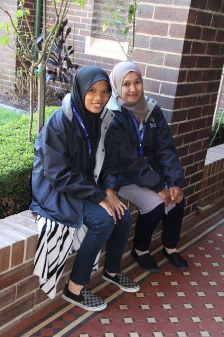 LEARNING: Indonesian teachers Annisa Aulra and her colleague Sufiati from MTs Abnal Amir, Gowa, are teaching about their culture and learning about Australia's at St Mary's Star of the Sea College. Picture: Supplied