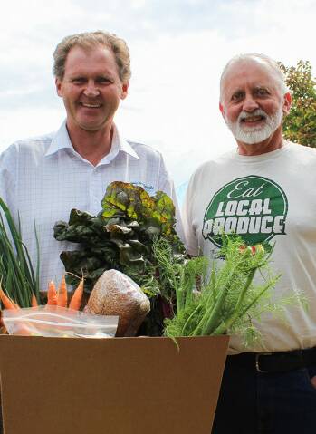 Market fan Mayor Lindsay Brown with produce and SAGE's Stuart Whitelaw. 