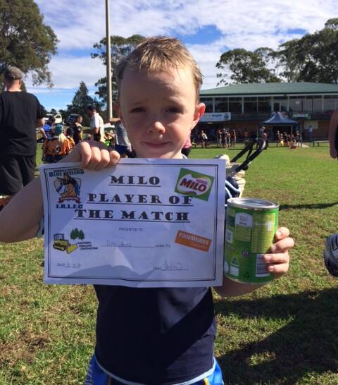 Bombala Junior Rugby League player and Milo Player of the Match Under 7's Cody Bruce with his certificate at Batemans Bay on Saturday.