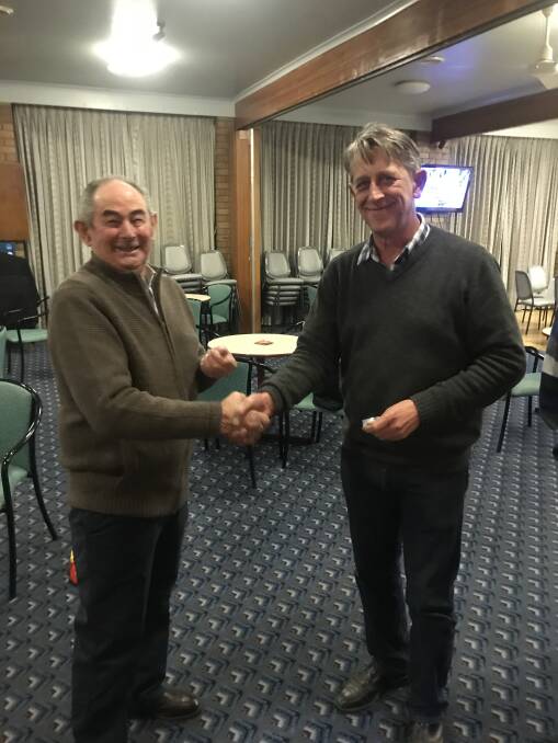 Delegate Golf Club pennants - Coopy Baker presents Nick Flower with his award.