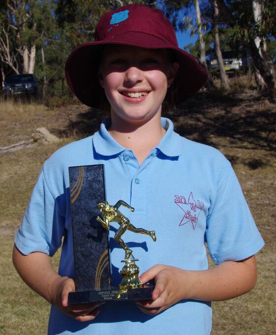 Bombala Public School student Zali Lavender with her Senior Girl Winners Trophy that she won at the school's athletics carnival recently.