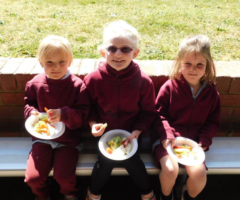 Bombala Public School held a Fruit and Vegie Crunch Day. Students Angel Stone, Sienna Wahrlich and Piper Sullivan join in eating healthy food.