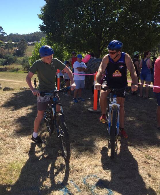 Reagan Hurley and Warren Hampshire getting ready to face off in the cycle section of Saturday's Triathlon Bombala Australia Day celebrations.
