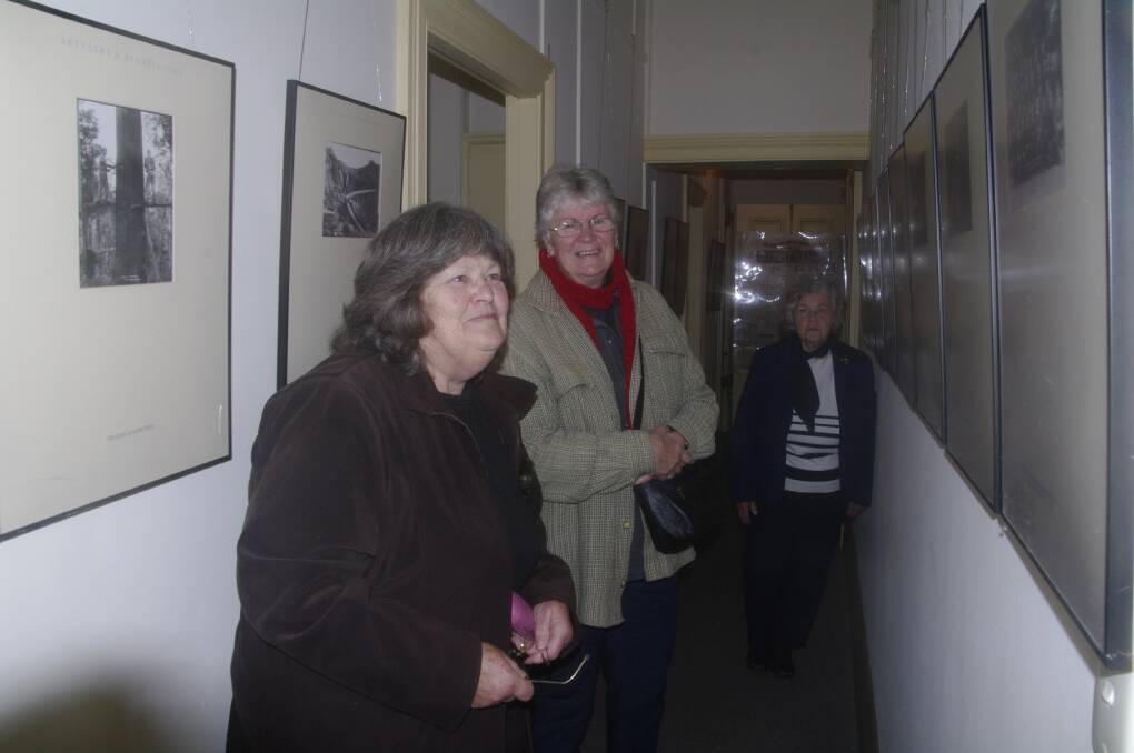 Anne Rolf and Kate Clery of Towamba along with Maurean Peisley admire some of the old photographs from the Bombala and District Historical Society archives.