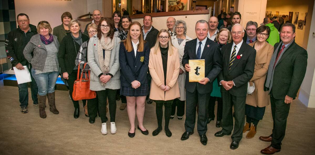 BOMBALA BATTLERS: Nikki Hepburn, Hannah Ingram, Teri Roberson and a contingent of well wishers presenting the book to Dr Brendan Nelson.