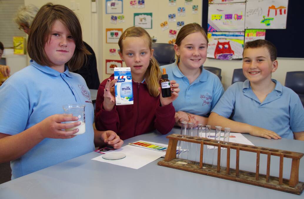Students Louise Faichney, Crystal Goodchild, Christine Cox and James McNamara prepare for their experiment.