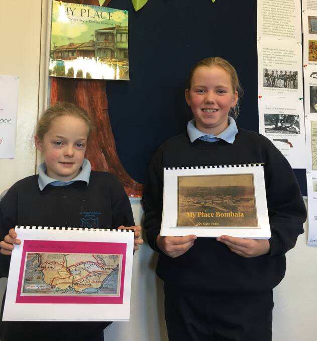 St Joseph's Primary School students Ezra Perkins and Kate Yelds display the work done on their family tree ready for Grandparents Day in Bombala.