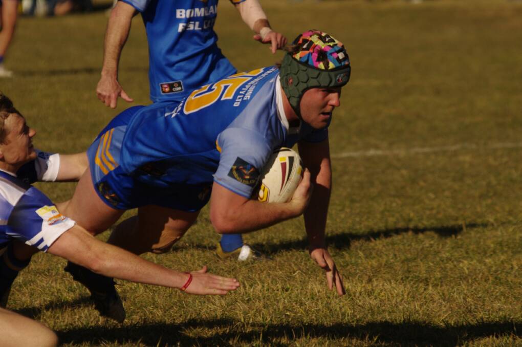 Bombala Blue Heelers rugby league first grade player Jackson Standen goes over the line to score in the Heelers' game against the Bulldogs.