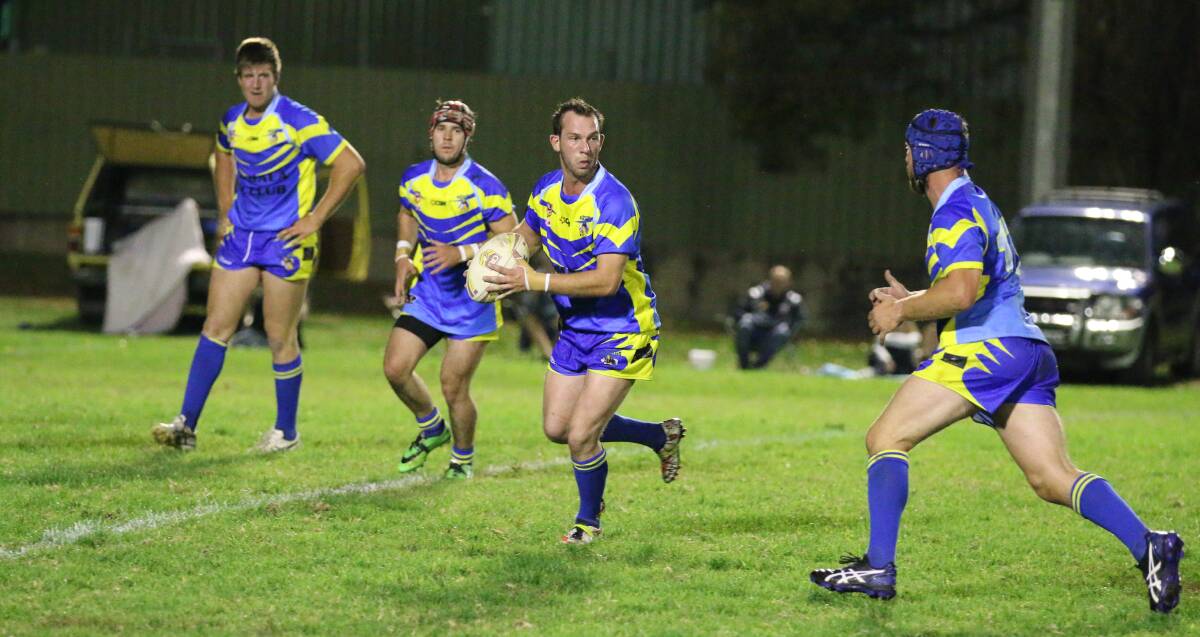 BLUE HEELERS: Andrew Anderson about to offload to brother Chris Anderson with Luke Ingram and Kurt Lomas looking on in the game against the Bega Roosters on Saturday.