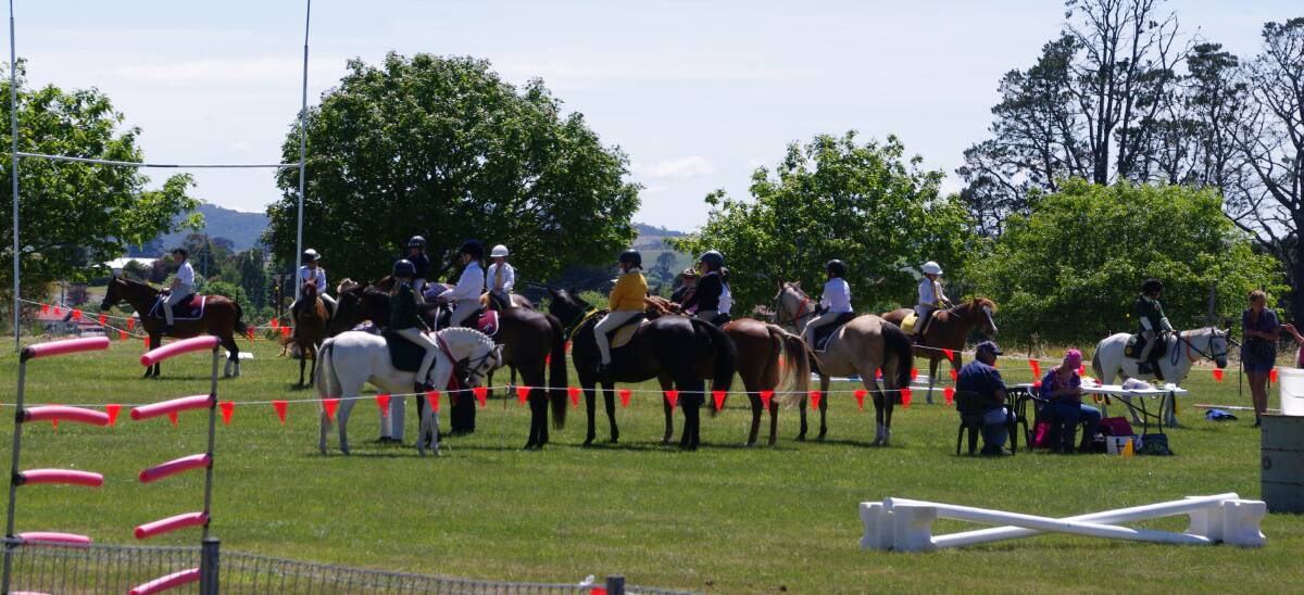 SHOW PONIES: Riders from pony clubs in Zone 18 prepare to go over the jumps at the Delegate Pony Club's first gymkhana in 16 years.