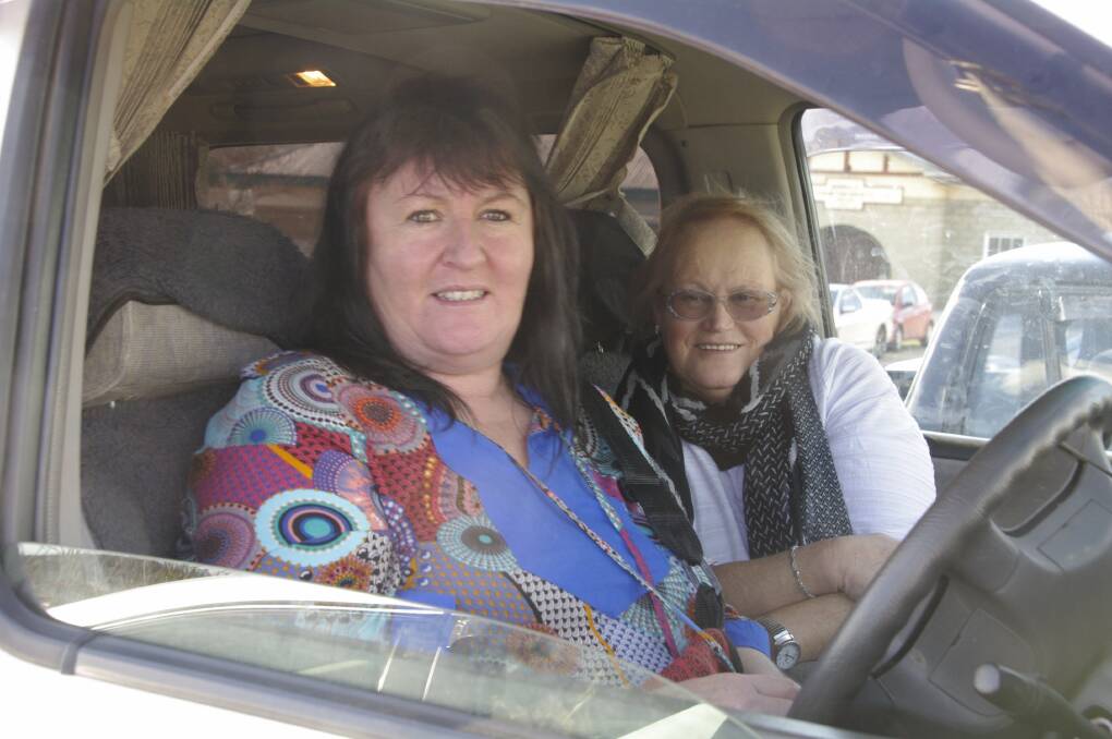 Keeping warm and comfortable in the front seat of their car at Sunday's footy games were Bombala's Adele Hodak and Anne Cockran.