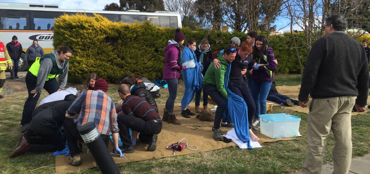 MOCK RESCUE: Bombala High School students acted as patients in the joint emergency services mock rescue of a bus crash that involved 26 visiting medical students from ANU.
