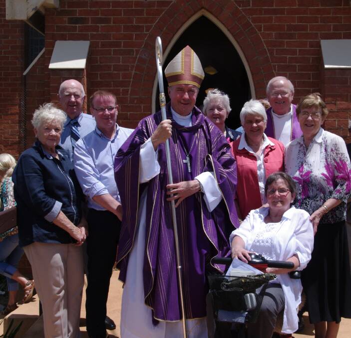 CENTENARY: Lorraine Cottrell, Clive Cottrell, Greg Crotty, Archbishop Christopher Prowse, Sandra Walker, Joyce Reed, Father Mick McAndrew, Sister Teresa Keane and Dolly Guthrie.
