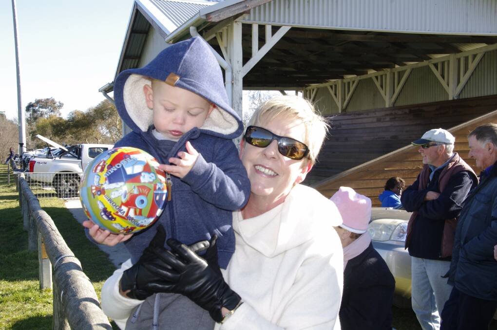 Leanda O'Brien with little Beau Kohler wrapped up nice and warmly to watch the Rugby League game in Bombala on Sunday.