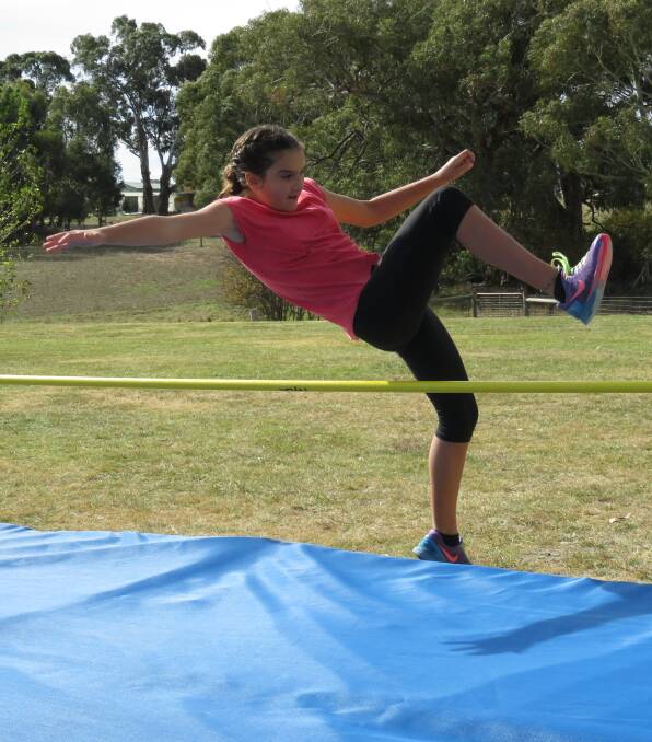 Larissa Ponsford clears the bar at High Jump during the Bombala High School Athletics Carnival. Larissa was also the 13 year girls age champion.