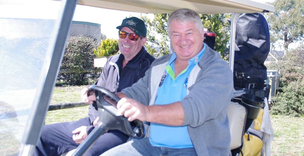 Jeff McDonald and Paul Halligan get ready to play a round at the Men of League golf day held on Bombala Golf Course on Saturday.