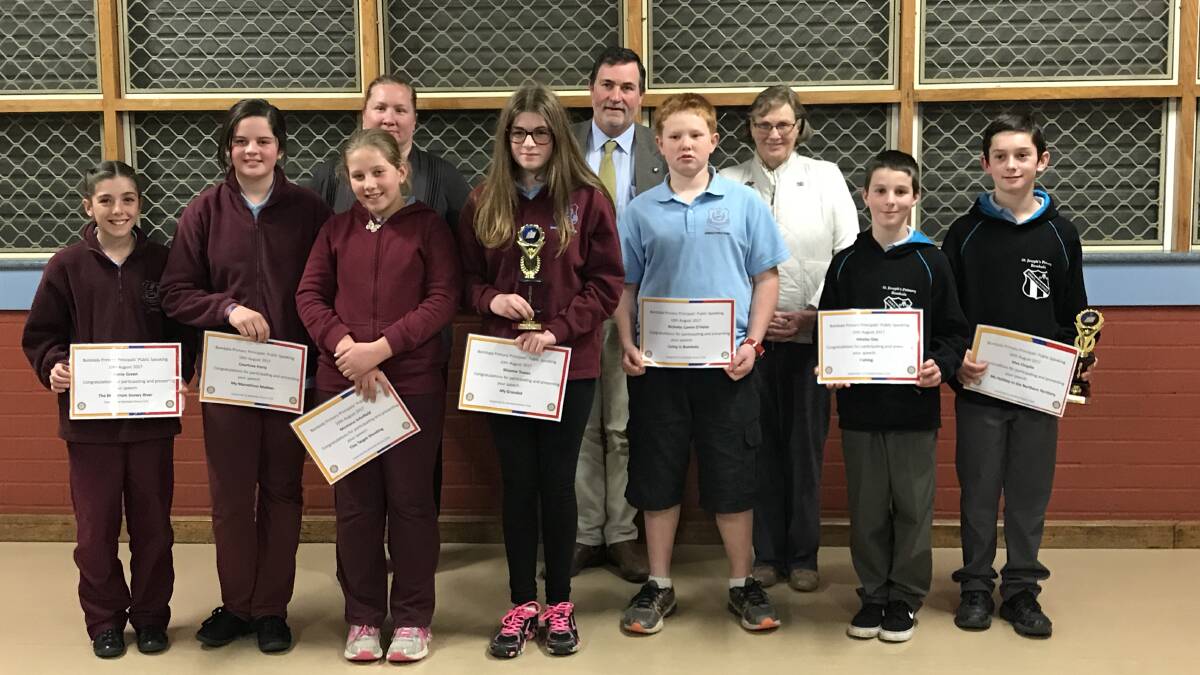 SPEAKERS: The three Rotarian adjudicators with the seven students from Bombala and St. Joseph's Primary School who participated.