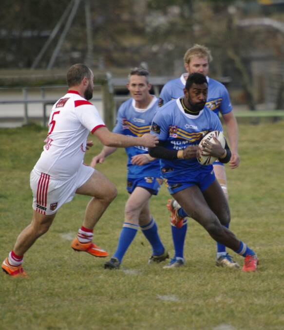 Bombala Blue Heeler Aborosio Navori uses some fancy footwork to side step the opposition in Saturday's Group 16 Rugby League game at Bombala on Saturday.