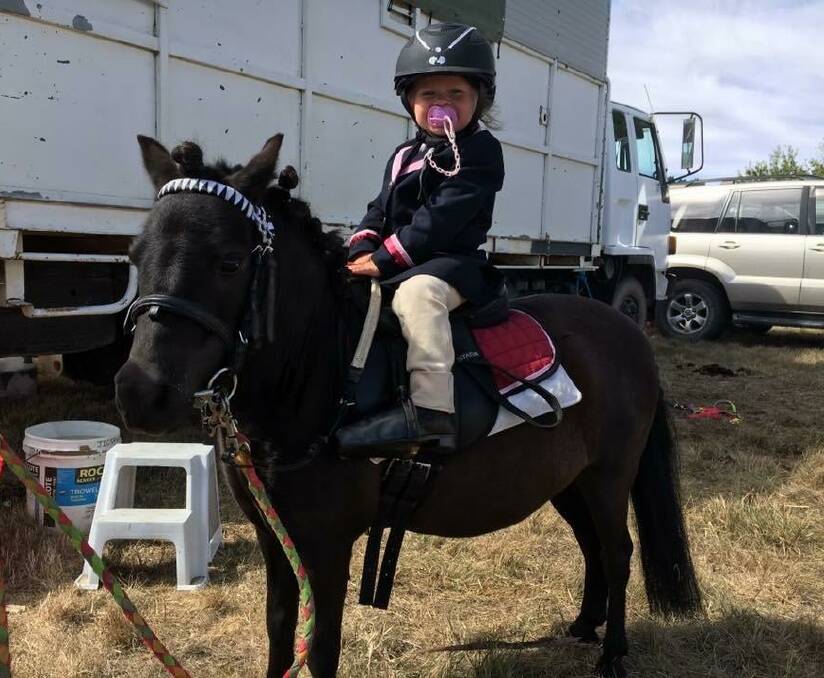 TINY TOT: Delegate Pony Club member little Myah Voveris on her pony Lolly get ready to compete at the Nimmitabel Show.