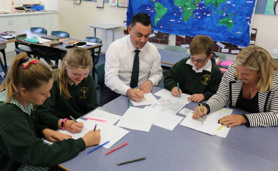 YOUNG DESIGNERS: John Barilaro MP and Bronnie Taylor MLC with St Pat’s Cooma students.