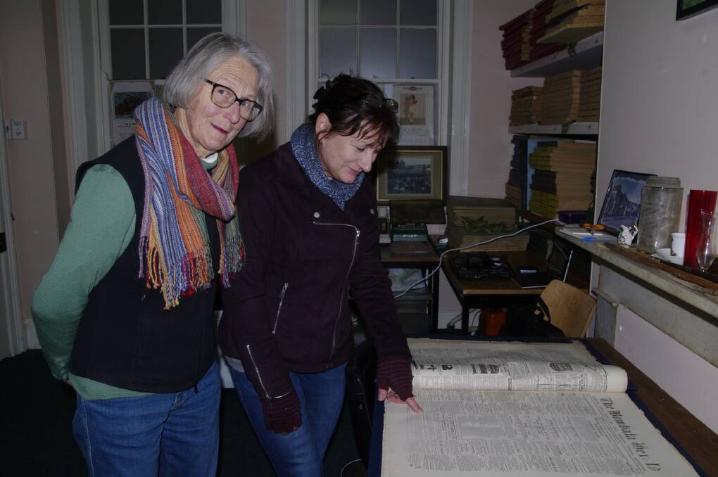 Checking out old editions of the newspaper at the Bombala & District Historical Society are Bombala's Marjorie Feilen and Wendy Crouch.