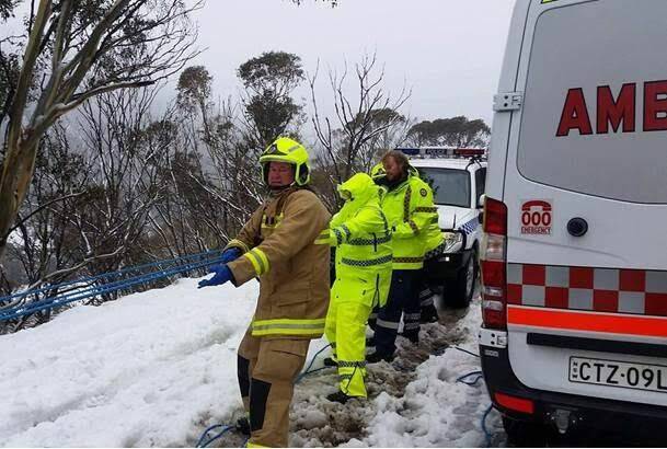 NSW Ambulance paramedics and NSW Police work to rescue a woman who fell and injured her knee on a remote Thredbo track on Thursday, August 17.