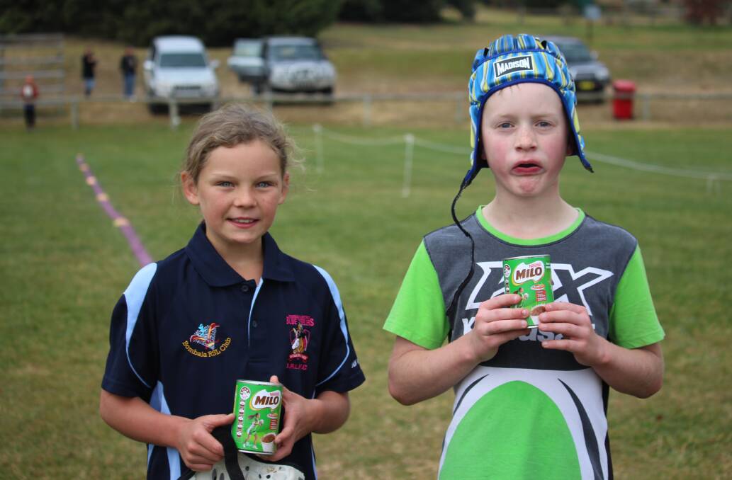 Bombala Junior Rugby League Club Milo Players of the Match U9s Heidi Brownlie and Tyler Ford with their awards on the weekend.