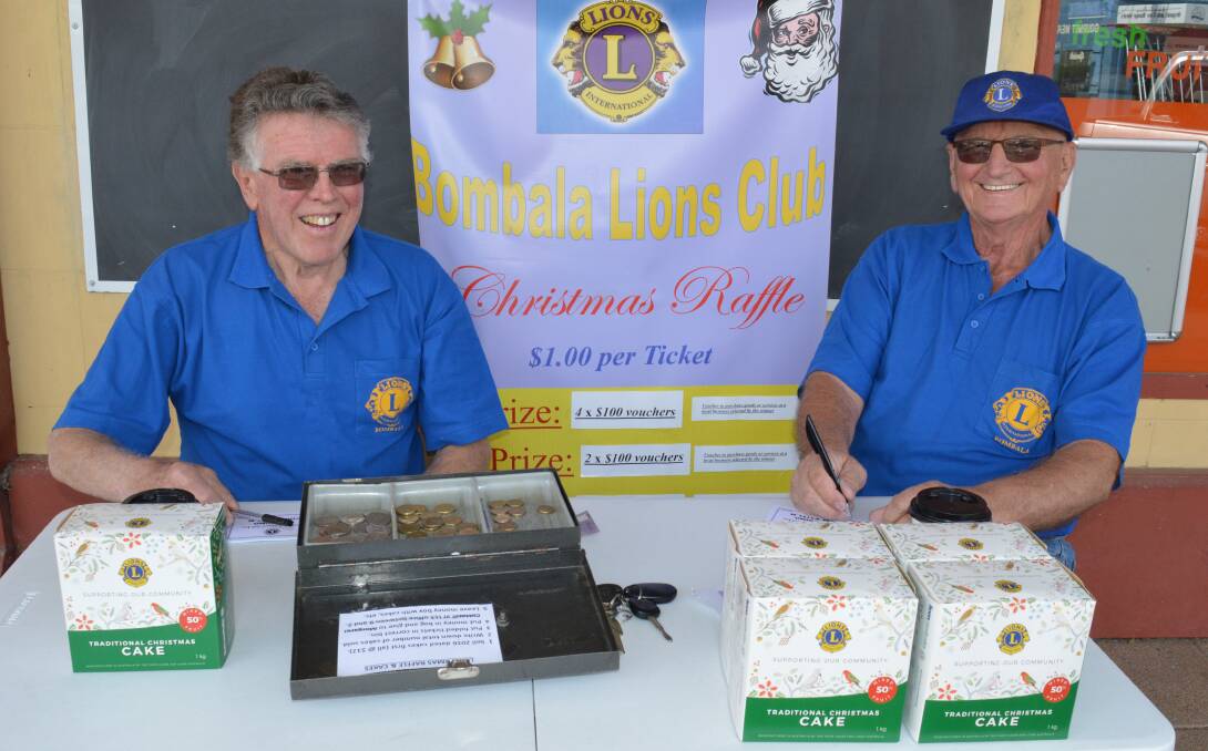 Doing their bit for the Bombala Lions Club - Murray Garnock and Graham Hampshire are out on the street on Saturday mornings selling Christmas Cakes and raffle tickets.