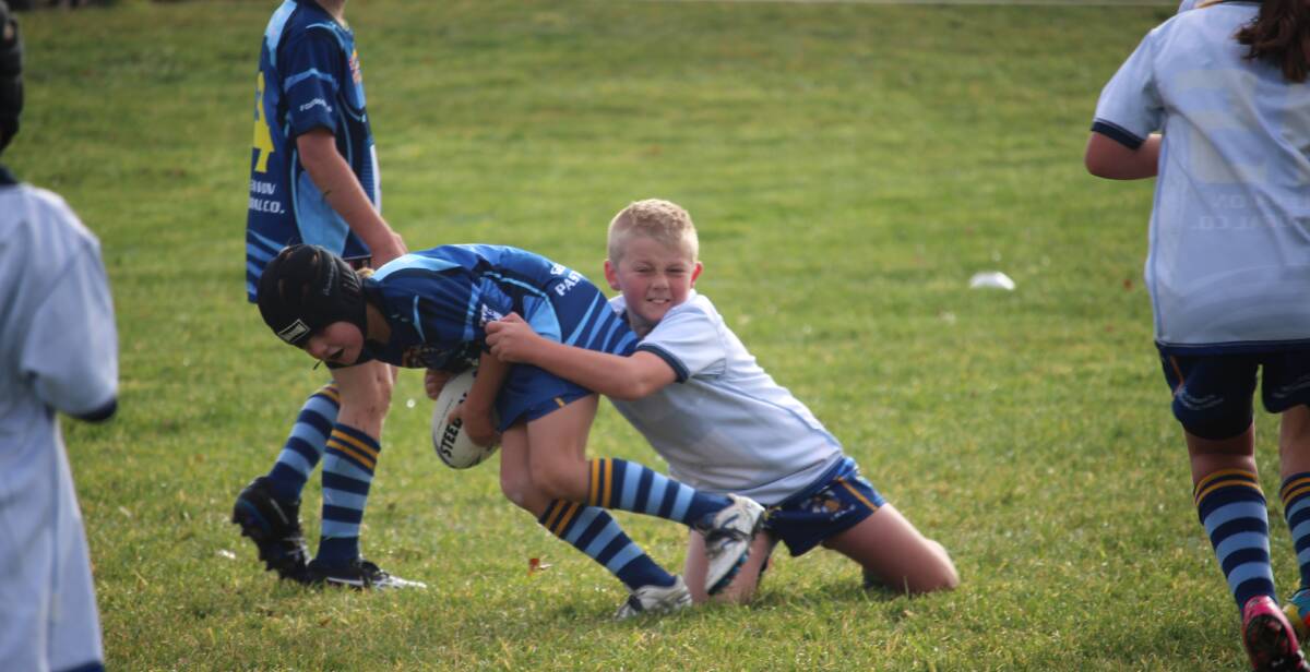 JUNIOR RUGBY: Bombala Junior Rugby League Blake Skellern tackles Alex Peisley during the weekend practice match.