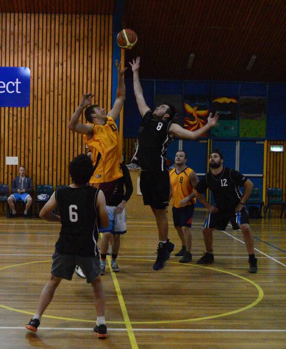 BOMBALA BASKETBALL:  In the men's Black versus Yellow basketball game, Black 52 defeated Yellow 41. Players Luke Ingram and Zach White tipping off.