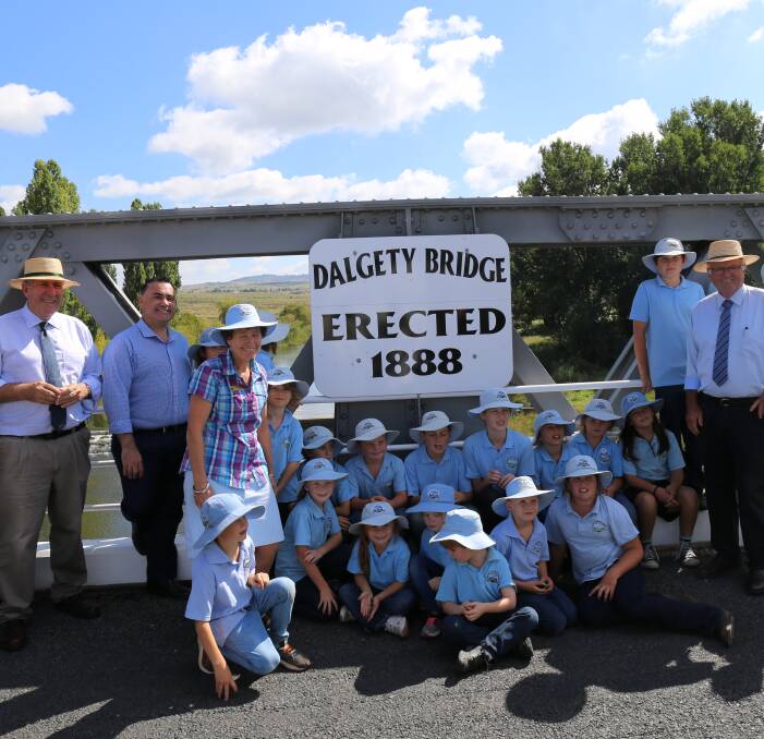 MAJOR UPGRADE: The Minister for Roads Duncan Gay and Member for Monaro John Barilaro with Dalgety Public School students welcome the major upgrade to the historic Dalgety Bridge on Monday.
