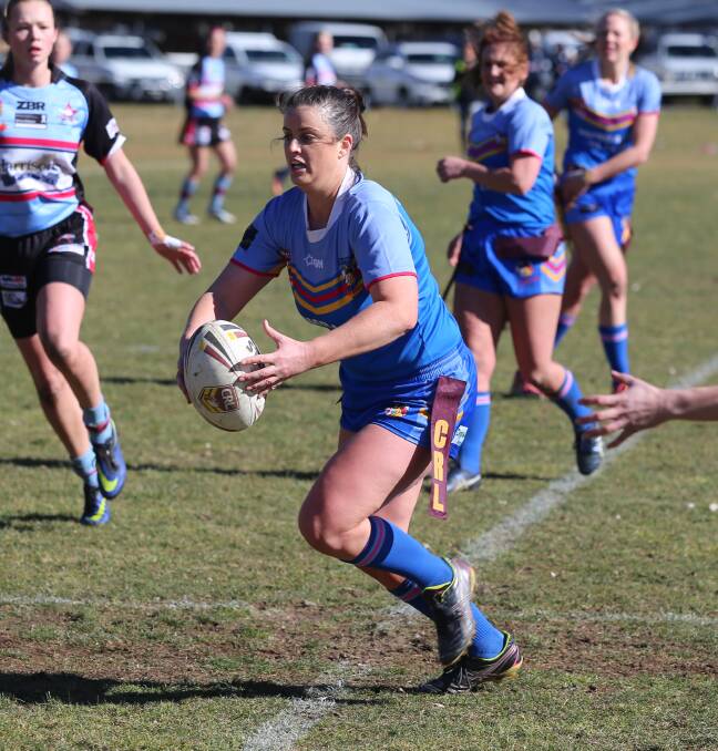 GRAND FINALISTS: Bombala High Heeler league tag player Monique Perkins looking to offload the ball during the women's semi final game against Moruya in Cooma.