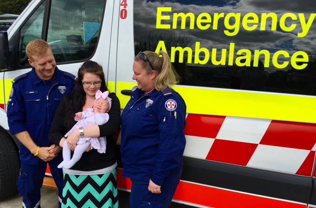 OH EVIE: Bombala Station paramedics Jason Wood and Sandra Lavender with mum Jodie Talbot and baby Evie.