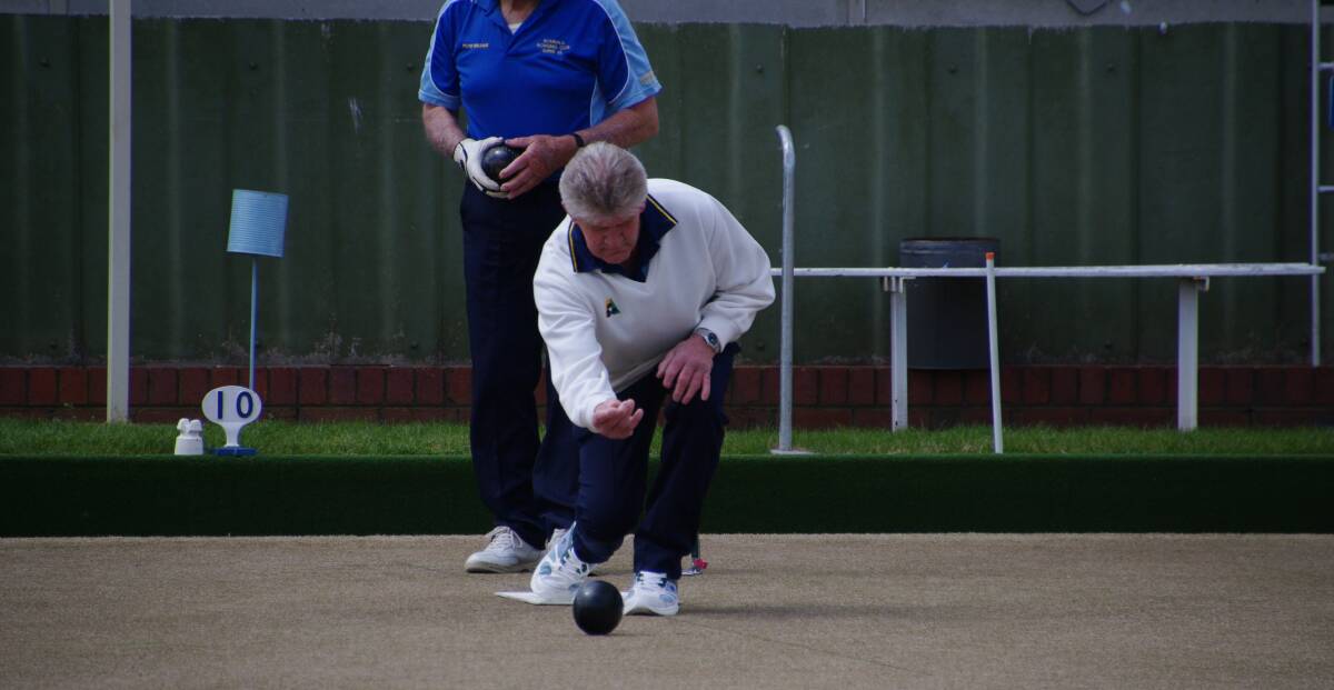 BOWLS: Neil Brotherton lays down a bowl during Saturday's final of the Bombala minor singles bowls championship.