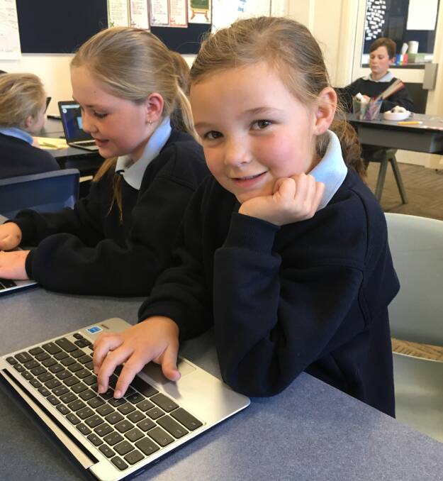 St Joseph's student Gracie Brownlie is quite happy about using her new Chromebook to help her share her work with teachers through Google Drive.