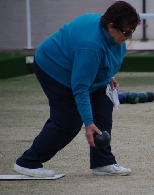 BOMBALA BOWLS: Jenny Brownlile lays down a bowl during a recent game at Bombala Bowling Club.