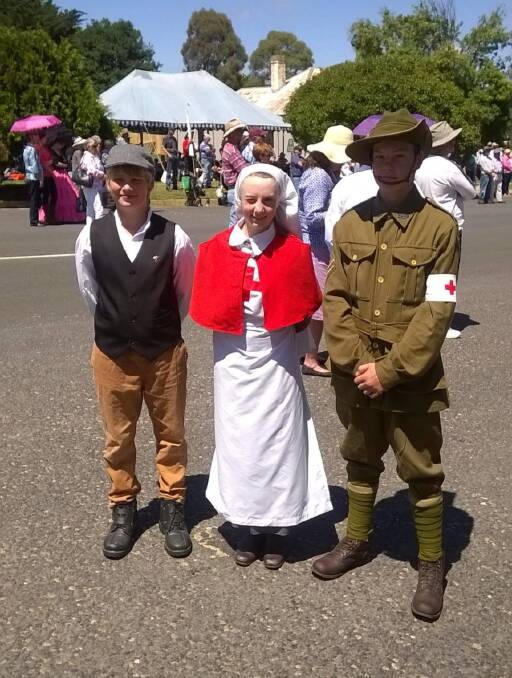WW1: Ellery Farran (centre) with Toby Jones and Noah Coles the three young people who marched in the Man From Snowy River recruitment march reenactment last year.