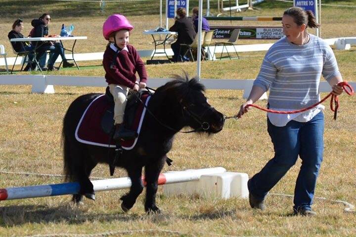 Delegate Pony Club member Anna Cameron and her mum Sinead doing the keyhole bounce at the Bemboka Pony Club gymkhana on the weekend.