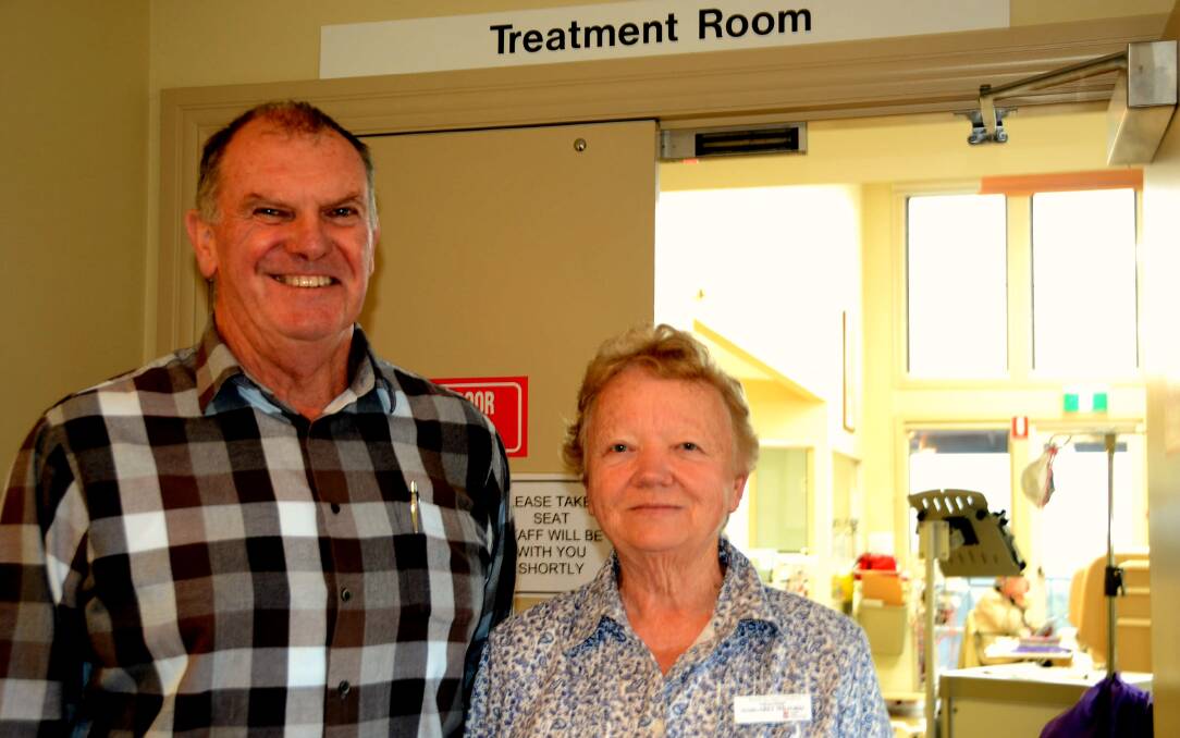 GETTING CLOSE: Volunteers Peter Still and Marg Wilford outside a current treatment ward, thinking ahead to fund raisers that will help pay off the new palliative care unit.